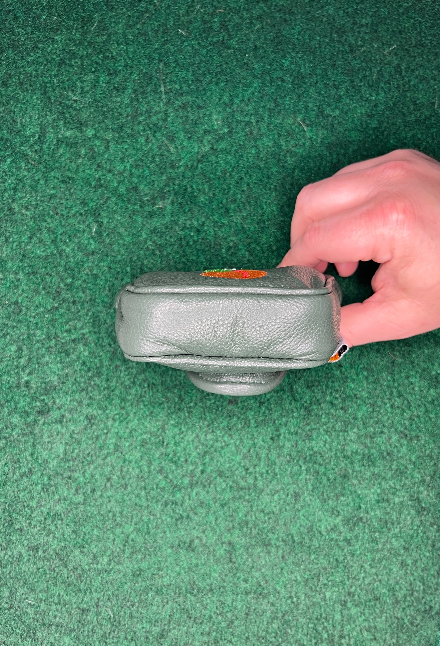 It's a Peach Green Mallet Putter Headcover